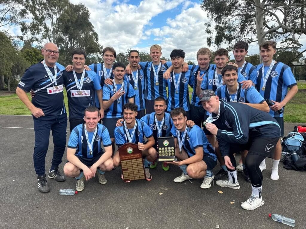 Hills Spirit senior team celebrating with the premiership trophy